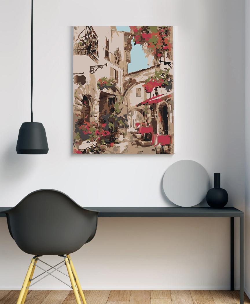 a room with a chair and a painting on the wall