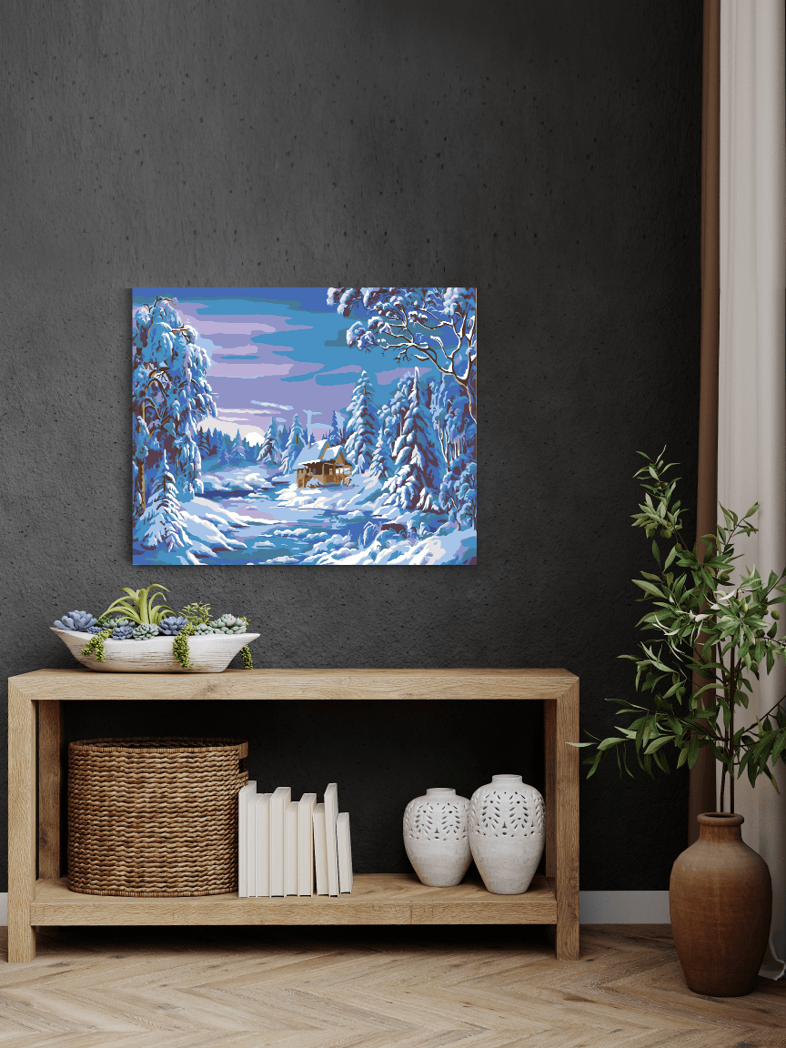 a painting of a winter scene on a wall