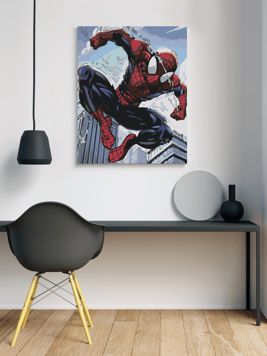 a painting of a spider man on a wall above a desk